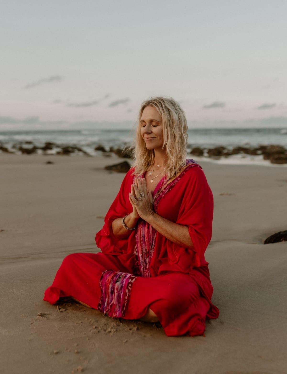 Kate Reardon meditating on the shoreline